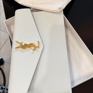 Yves Saint Laurent White Clutch with Gold Logo